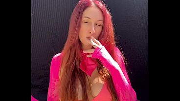 Sexy big tits Artemisia Love smoking a cigarette outdoor