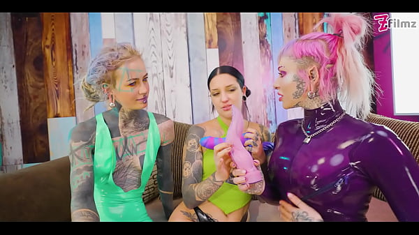 Two dominas gang up on Goth chick to fill her holes with toys and make her cum